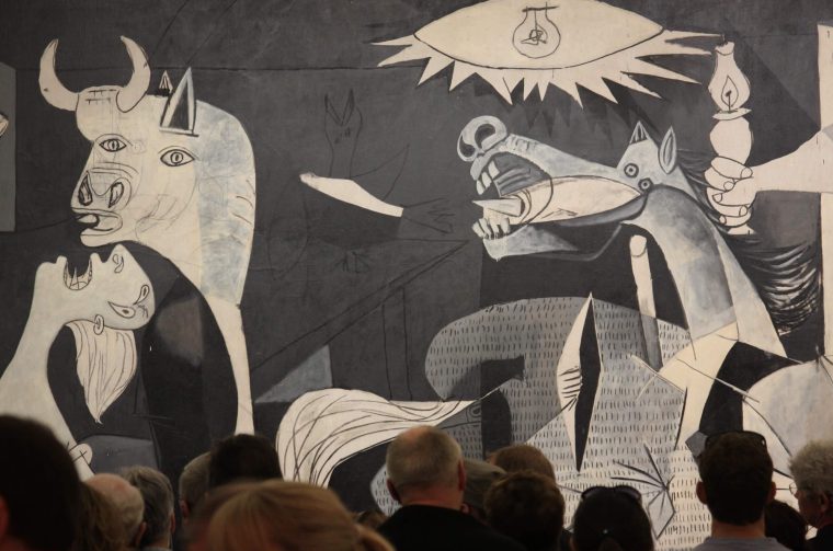 Pablo-Picasso-–-Guernica-detail-1937-oil-painting-on-canvas-3.49-x-7.77m-installation-view-Museo-Reina-Sofía-Madrid-Spain-scaled-1